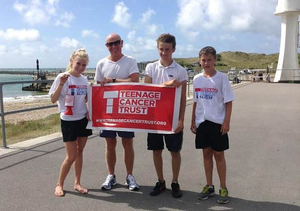 Running for charity  Nadia Muncey, left, with dad Kev Muncey, friend Will Hayler and Charlie Muncey, right, after completing their pier-to-pier run