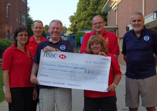 NWSS members Mike Wilson (third left) and Ian Morris (far right) present their cheque to Horsham Community First Responders (from left to right Hilary, Andrew, Marc and Ali).