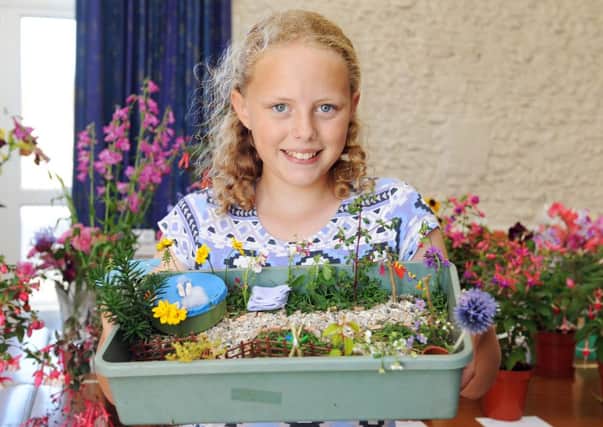 Katie Hill with her miniature garden     L32080H13