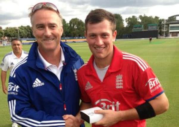 Harry Finch receives his man of the match award for England under-19s from former Surrey and England batsman Graham Thorpe