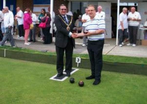 Town mayor Cllr Alan Roberts and sponsor Mark Gardiner get the 2013 Hastings Open Bowls Tournament underway