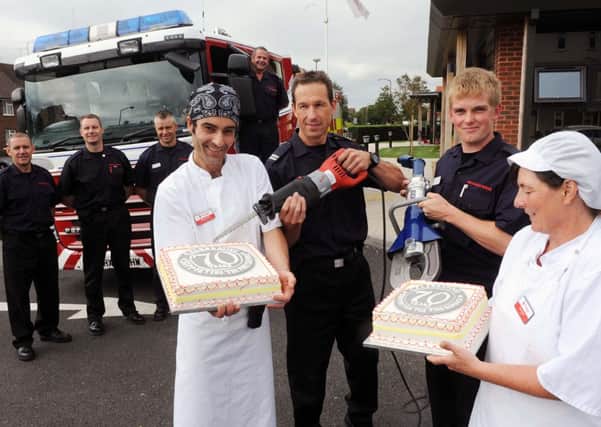 Firefighters in Littlehampton cut the birthday cake at Marine Court             L34534H13