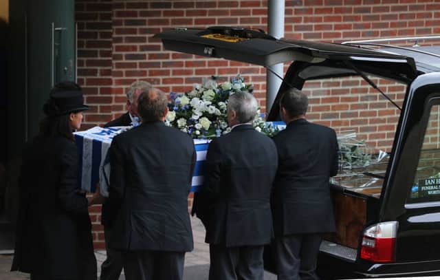 Roy Chuter's coffin is carried into Worthing Cremartorium
