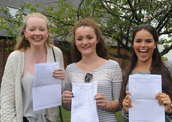 Emily Hill, Georgie Kemp, and Katie Robertson receving their GCSE results at the Cranleigh School (submitted).