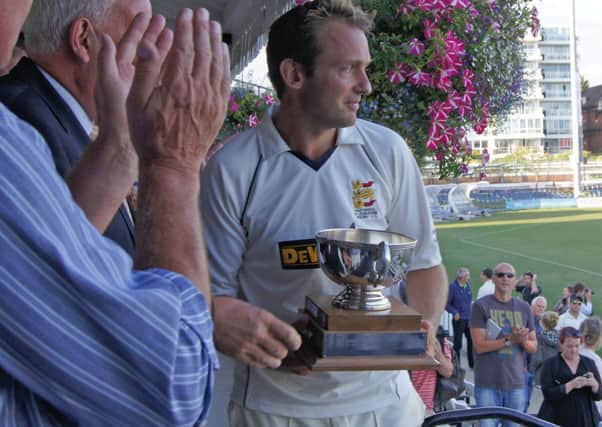 Hastings Priory captain George Campbell receives the trophy for winning the Gray-Nicolls Sussex T20 Cup. Picture courtesy regwoodphotography