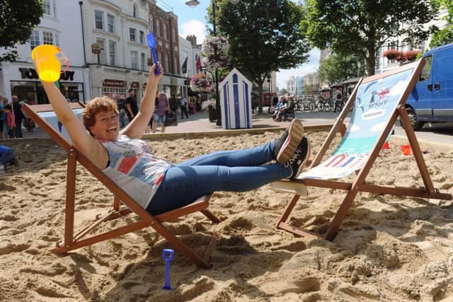 W32715H13  The new Sand Beach in South Street Square. Town Centre Manager Sharon Clarke on the Beach