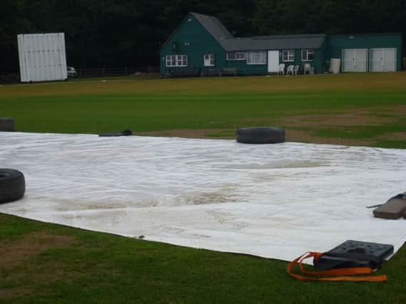 The soggy scene at Crowhurst Park Cricket Club yesterday. Picture by Simon Newstead