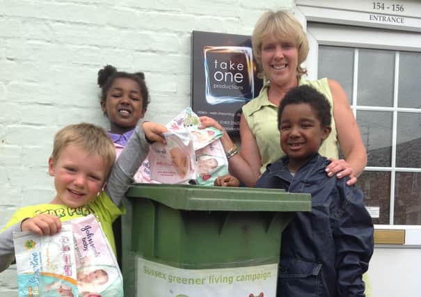 Carrie Cort and local children from Horsham with the public access collection bin