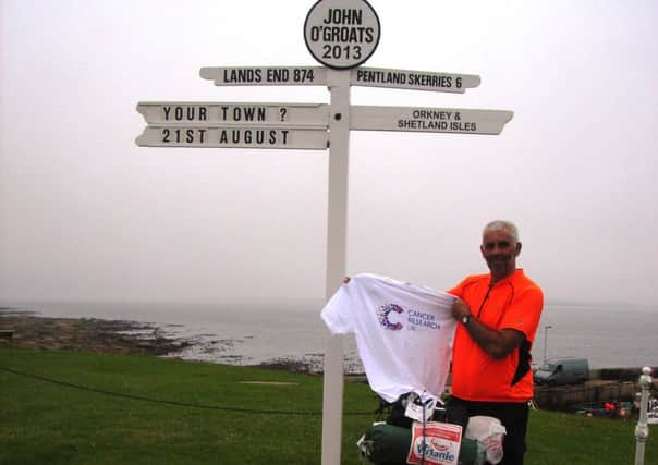 Guy Burridge at the finishing line of his epic cycle journey to Scotland