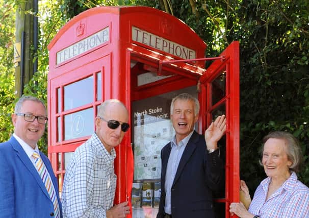 JPCT 270813 Launch of telephone box information centre at North Stoke.  Andrew Shaxson, Chaiman of the Planning Committee, South Downs Nation Park Authority, and Janet Aidin, Chairman of the Wiggonholt Association. Photo by Derek Martin