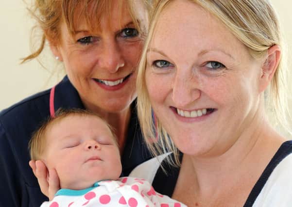 JPCT 270813 S13351126x Horsham hospital. First baby born at hospital for 28 years. Mid-wife Caroline, mother Heidi and baby Josie -photo by Steve Cobb