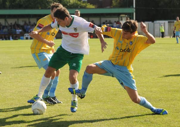 Harvey Whyte gets past two Canvey Island opponents  Picture by Louise Adams C131218-2