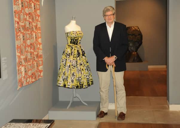 Alan Farndon with the Paolozzi dress, exhibited at Pallant Gallery     Picture by Louise Adams C131224-1 Chi Paolozzi