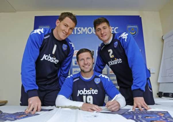 Jamie Ashdown, David Norris and Joel Ward, pictured here left to right as they  signed up to the Pompey share scheme last year, are all owed money by the club