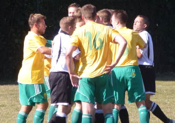 Tempers flare during the local derby between Westfield and Bexhill United on Saturday. Picture by Simon Newstead