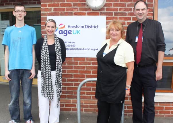 Jamie Waller, left, with staff at Age UK Horsham District in Horsham town centre (submitted).