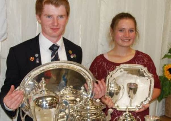 Rob Dowling and Sara Carr with their Bisley haul of trophies