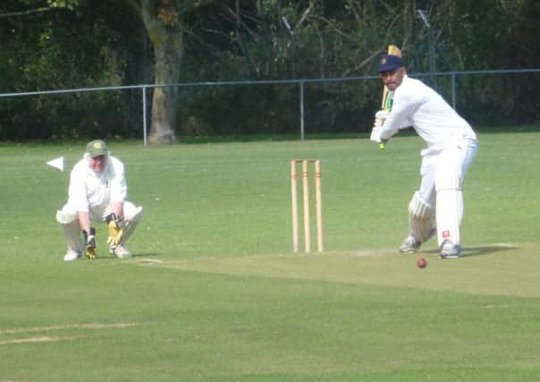 Sandun Dias winds up for a big shot during Rye's narrow defeat against Heathfield Park. Picture by Simon Newstead