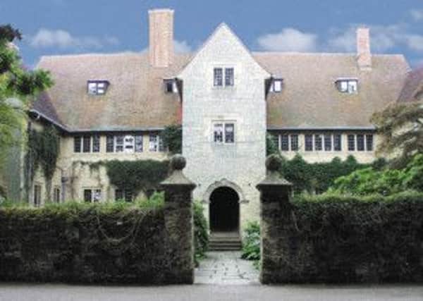 Little Thakeham in Sussex, designed by Sir Edwin Lutyens.
Far left: A red earthenware jardinière on stand, designed by Archibald Knox for Liberty & Co.
