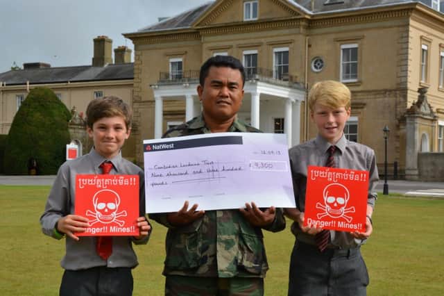 Aki Ra with Westbourne House students Jack Patrick and Dominic Russell who both fundraised for the Landmine Relief Fund