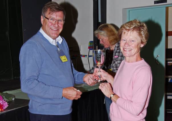 Chairman John Dyball presents cup to his wife Anne Dyball