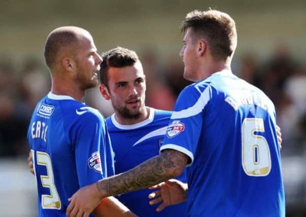 Danny East, centre, with team-mates Johnny Ertl and Sonny Bradley, right. Picture: Joe Pepler