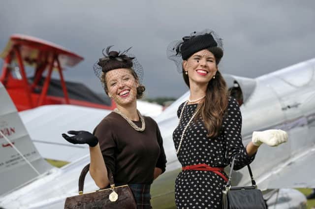13/09/13  ST

The Goodwood Revival race meeting 2013. (left to right), Brittney Francis, and Kandis Twa from Canada.
Picture: Ian Hargreaves  (132530-5)