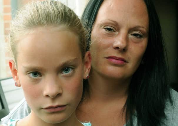 Attack victim Abigail Tichener, ten, with her mother    L39843H13