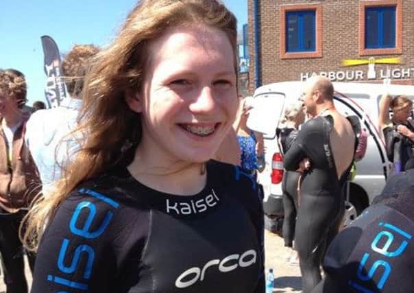 Tess Lauratani, 14, of Rustington will be tackling a 5,000m route in the River Arun to raise money for disabled neighbour, Molly Green, 11