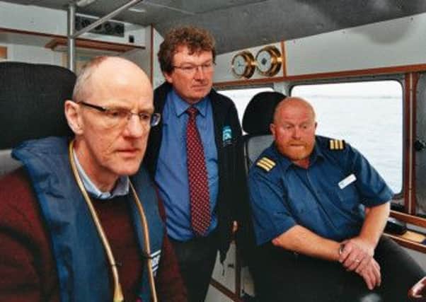 Nick Gibb with Tim Dapling and Charlie Hubbard on board the Watchful
PICTURE: JOHN PERIAM