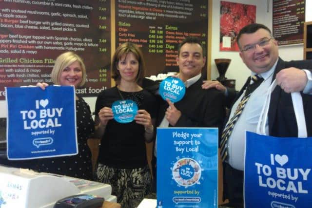 Left to right: Best of Worthing owner Melanie Peters, with All Beef Burger Co owners Sandra Aguiar and Fernando Alvarez, and Worthing mayor Bob Smytherman. All promoting Buy Local campaign