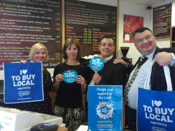 Left to right: Best of Worthing owner Melanie Peters, with All Beef Burger Co owners Sandra Aguiar and Fernando Alvarez, and Worthing mayor Bob Smytherman. All promoting Buy Local campaign