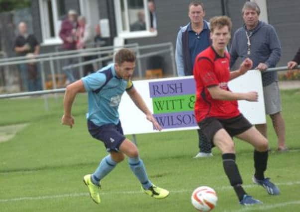 Evan Archibald on the ball for Rye United in their 3-1 win over AFC Uckfield last weekend. Picture by Simon Newstead