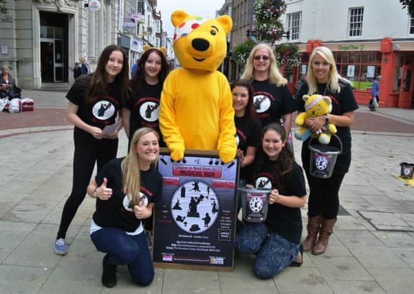 Fundraising in Worthing town centre, including singing and dancing