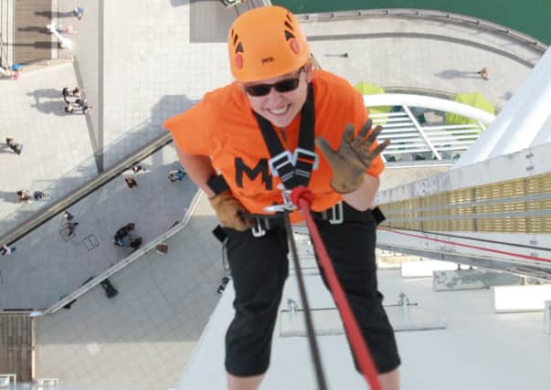 Michelle Silcock, of Littlehampton, completes her charity abseil in Portsmouth