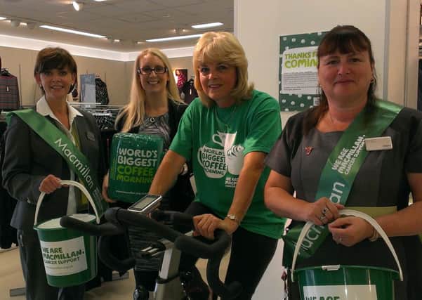 Workers at Marks and Spencer Crawley helping to raise Â£1,000 for MacMillan Cancer