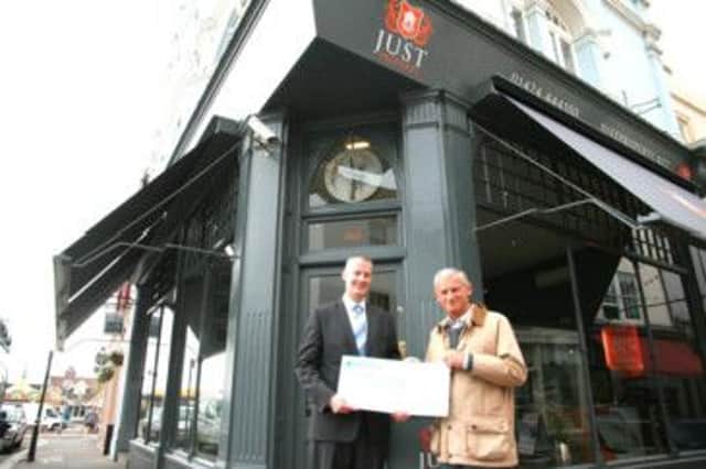 Simon Ollivant receives a competition cheque from Just Property partner Ben Davey.
