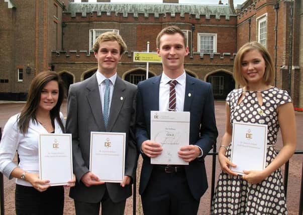 Four former Steyning students with their gold awards
