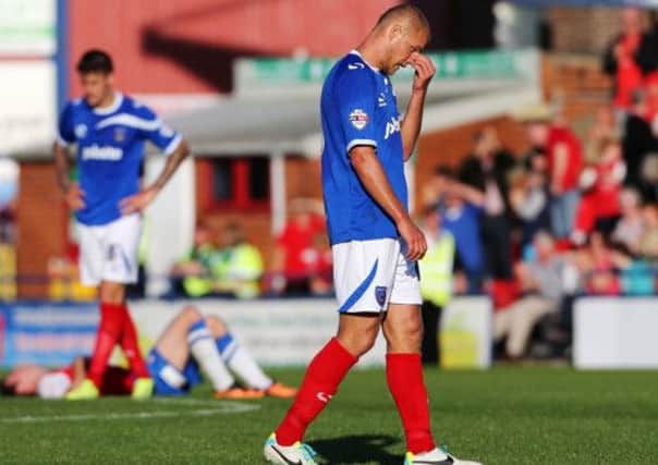 Johnny Ertl stands dejected following Pompey's performance against York on Saturday Picture: Joe Pepler