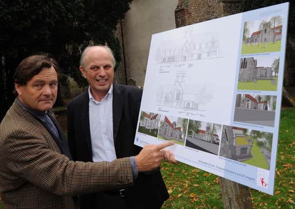 W40514H13   Reverend  Peter Irwin-Clark and Brian Smith with plans of the new extension