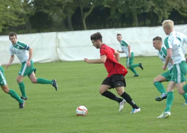 Olly Lockyer on the run for Rye United during their weekend defeat to Chichester City. Picture by Simon Newstead
