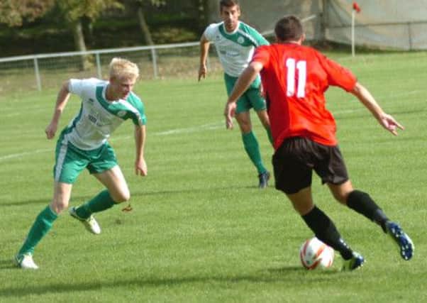 Liam Upton, pictured here running at a Chichester City defender on Saturday, scored Rye United's consolation in the 3-1 loss to East Grinstead Town. Picture by Simon Newstead