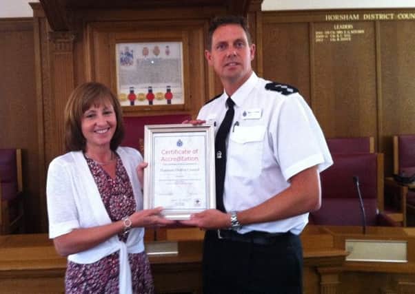 Sue Rogers, HDC's cabinet member for a safer and healthier district and Chair of the Horsham District Community Safety Partnership., with Chief Inspector Howard Hodges, Horsham district policing commander.