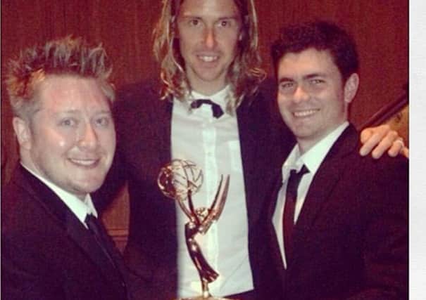 Emmy Award-winner Adam Wood, left, with colleagues at the awards night