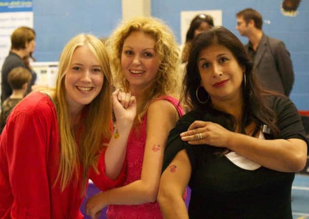 Staff showing off their tatoos. From left, Fiona Lillywhite, Hannah Wachnianin, and Dr Natasha Halliwell