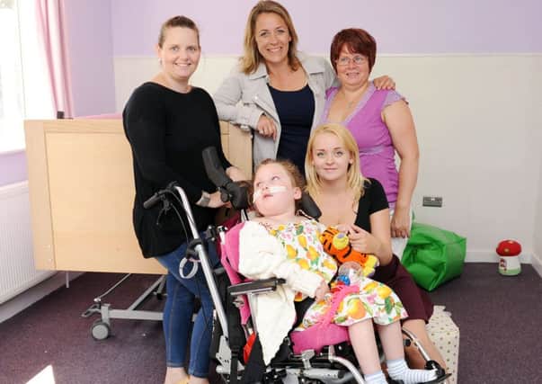 Vicki Thorne with Iona-May, seven, Channel 4 property star, Sarah Beeny, Andrea Thorne and Katie Brewster (carer)