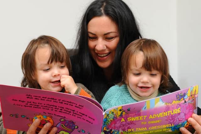 JPCT 081013 Tara Cresswell, mother of twins Donnie, left and Hugo ( aged 2) has written a 'mirrored' book. Photo by Derek Martin