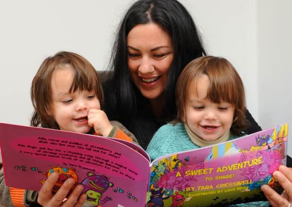 JPCT 081013 Tara Cresswell, mother of twins Donnie, left and Hugo ( aged 2) has written a 'mirrored' book. Photo by Derek Martin