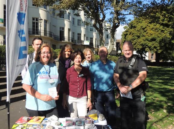 PC Marvin Lucas (far right) with representatives from various organisations working with Sussex Police to tackle the problem of street drinkings
