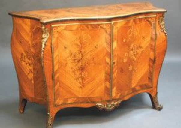 An early George III kingwood parquetry and marquetry commode of serpentine bombé form, attributed to Pierre Langlois, auctioned at Tooveys for £160,000.